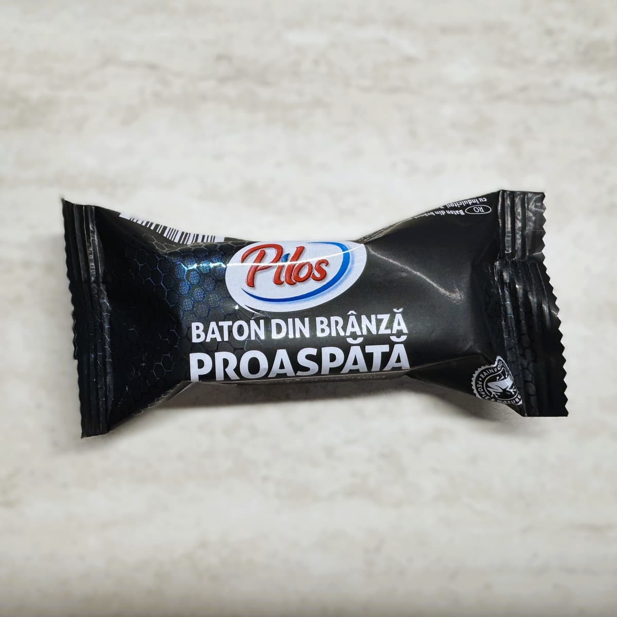 Pilos Baton din brânză proaspătă în glazură de cacao bogat în proteine